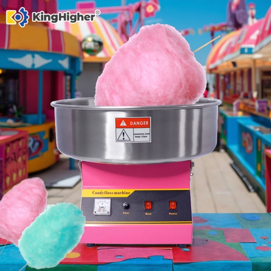 Commercial cotton candy machine in pink with candy floss at carnival