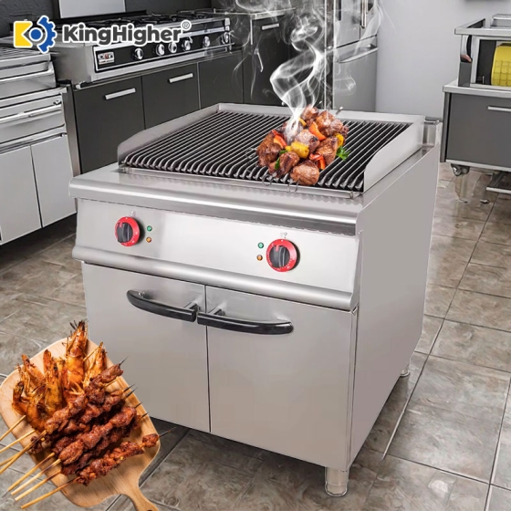 commercial electric lava rock grill cooking skewers in professional kitchen